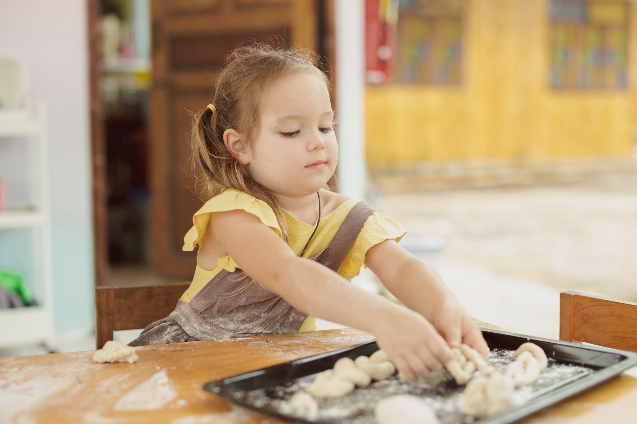 Child baking at Bamboo Valley