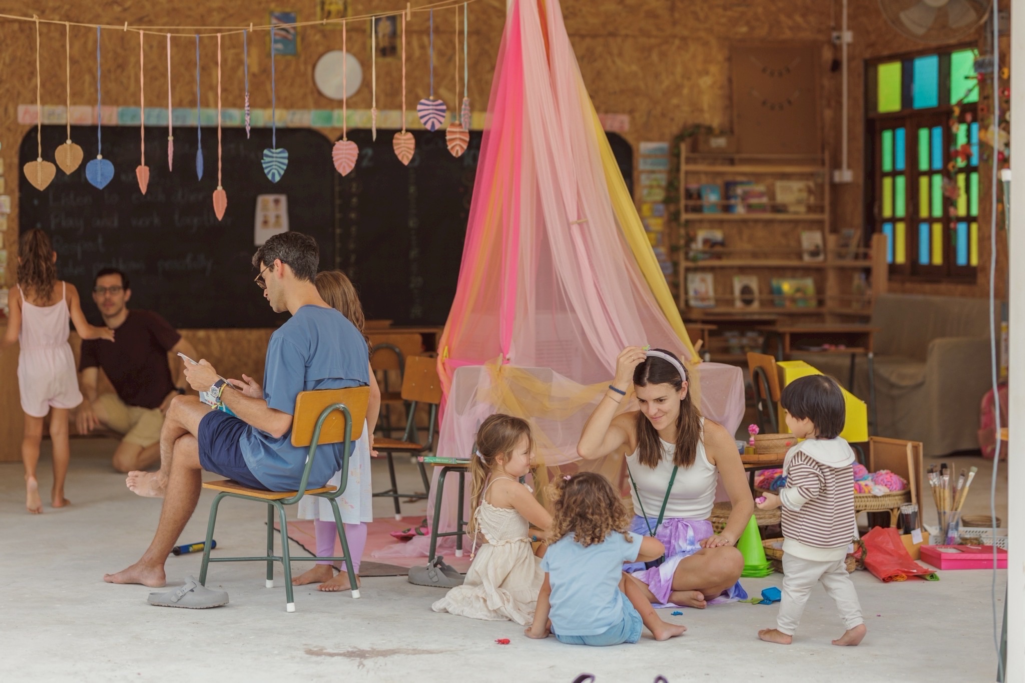 Parents and children in classroom at pickup time