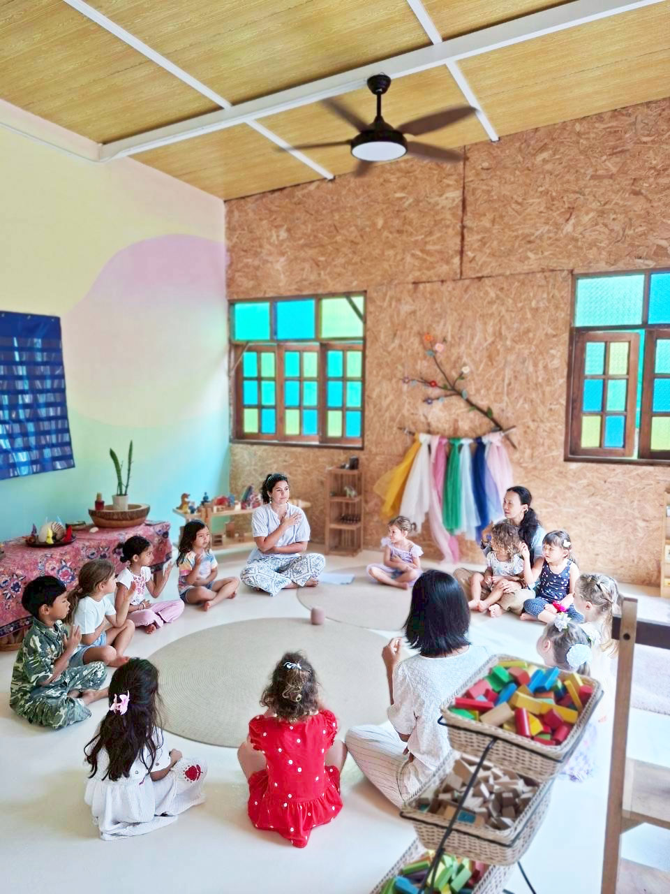 Children gathered for story time in Waldorf classroom